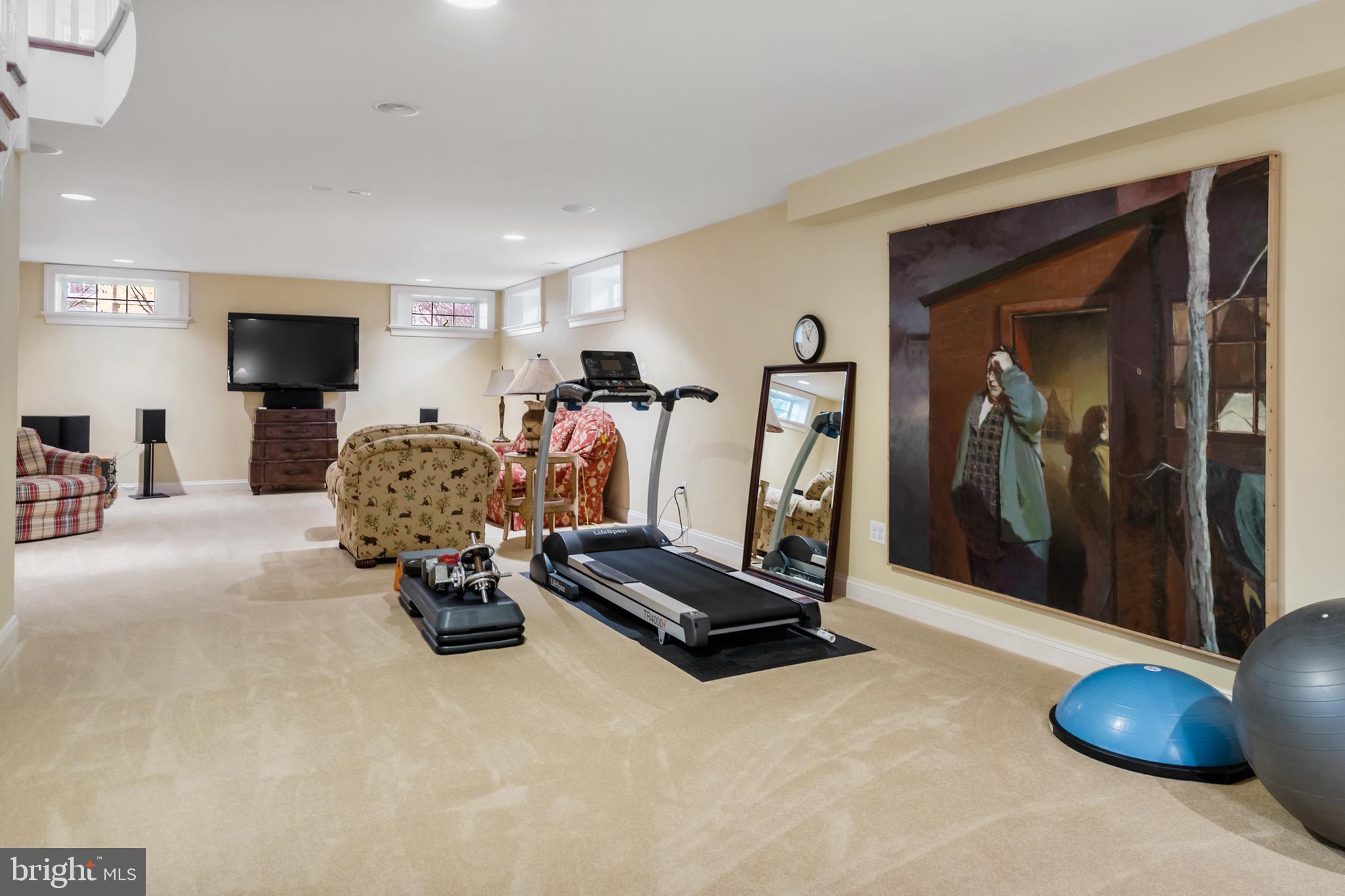 809 Matlack Drive Moorestown, NJ 08057 - Photo 54 of 67 a room with gym equipment and a flat screen tv