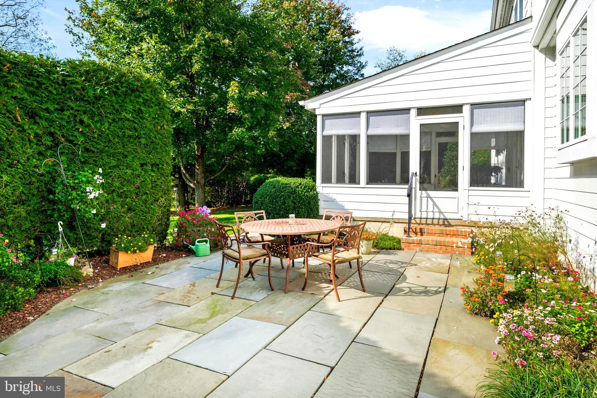 809 Matlack Drive Moorestown, NJ 08057 - Photo 61 of 67 a view of a patio with couches table and chairs and potted plants