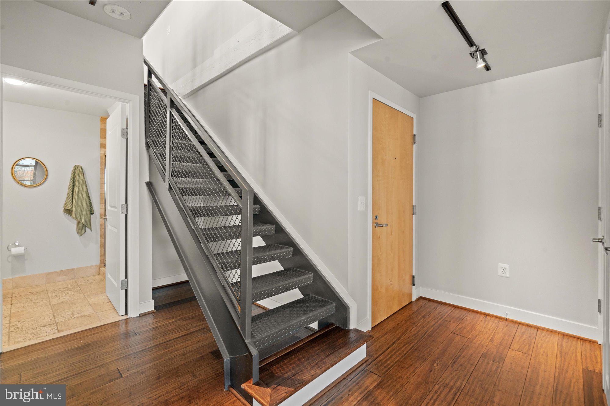 2125 14th Street Northwest, Unit 915 Washington, DC 20009 - Photo 20 of 28 Front entry hall with coat closet and stairway