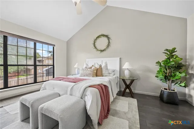 a bedroom with bed and a window