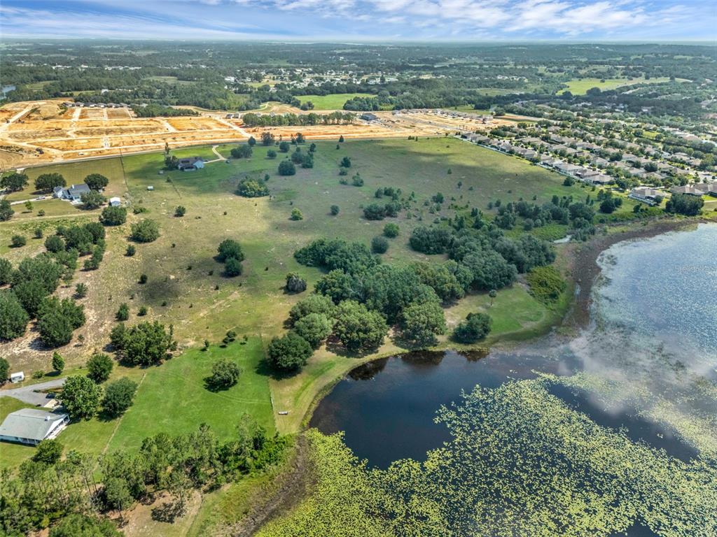 Starcrest Lane Clermont, FL 34715 - Photo 12 of 22 an aerial view of residential houses with outdoor space and river