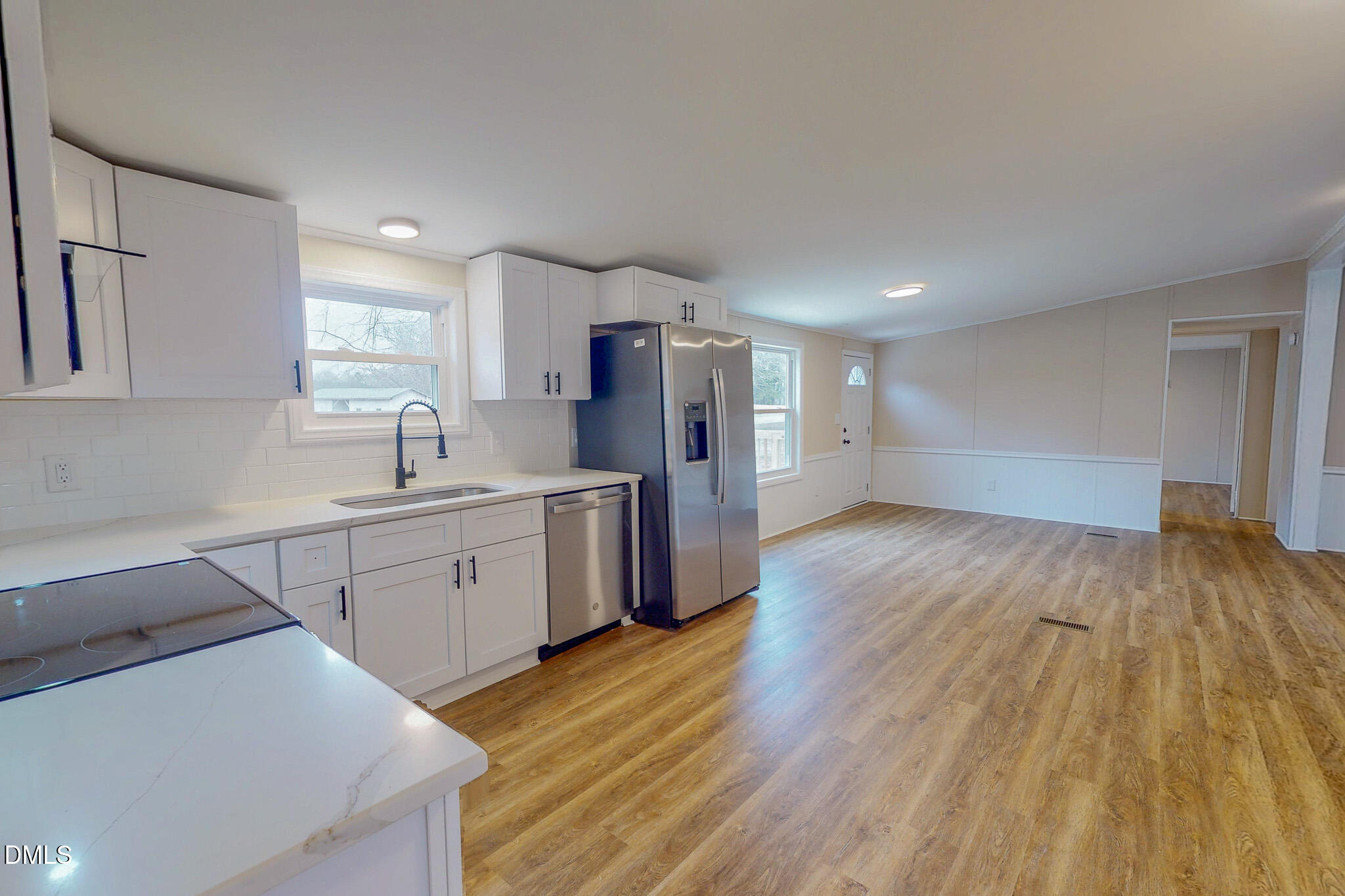 67 Halifax Road Roxboro, NC 27574 - Photo 31 of 48 a kitchen with cabinets and wooden floor
