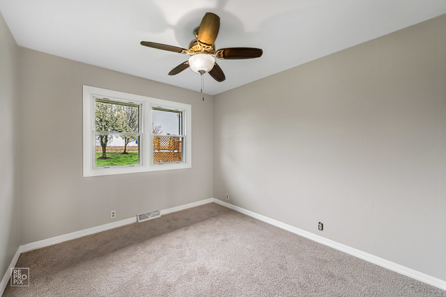 25915 South Tehle Road Elwood, IL 60421 - Photo 8 of 15 a view of room with ceiling fan and window
