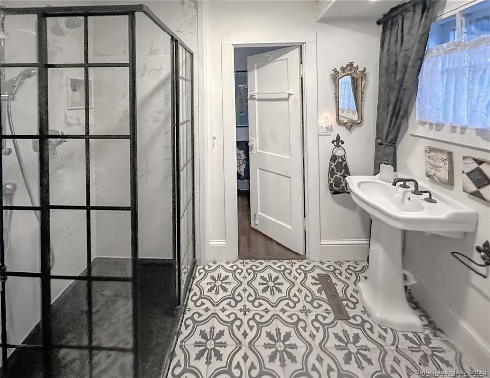 47 Johnson Road Kent, CT 06757 - Photo 12 of 40 a bathroom with a sink a mirror and shower