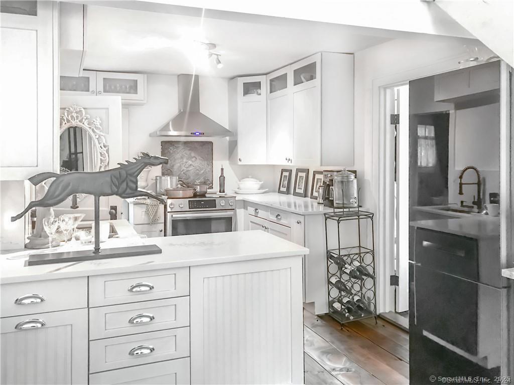 47 Johnson Road Kent, CT 06757 - Photo 2 of 40 a kitchen with cabinets a sink and appliances