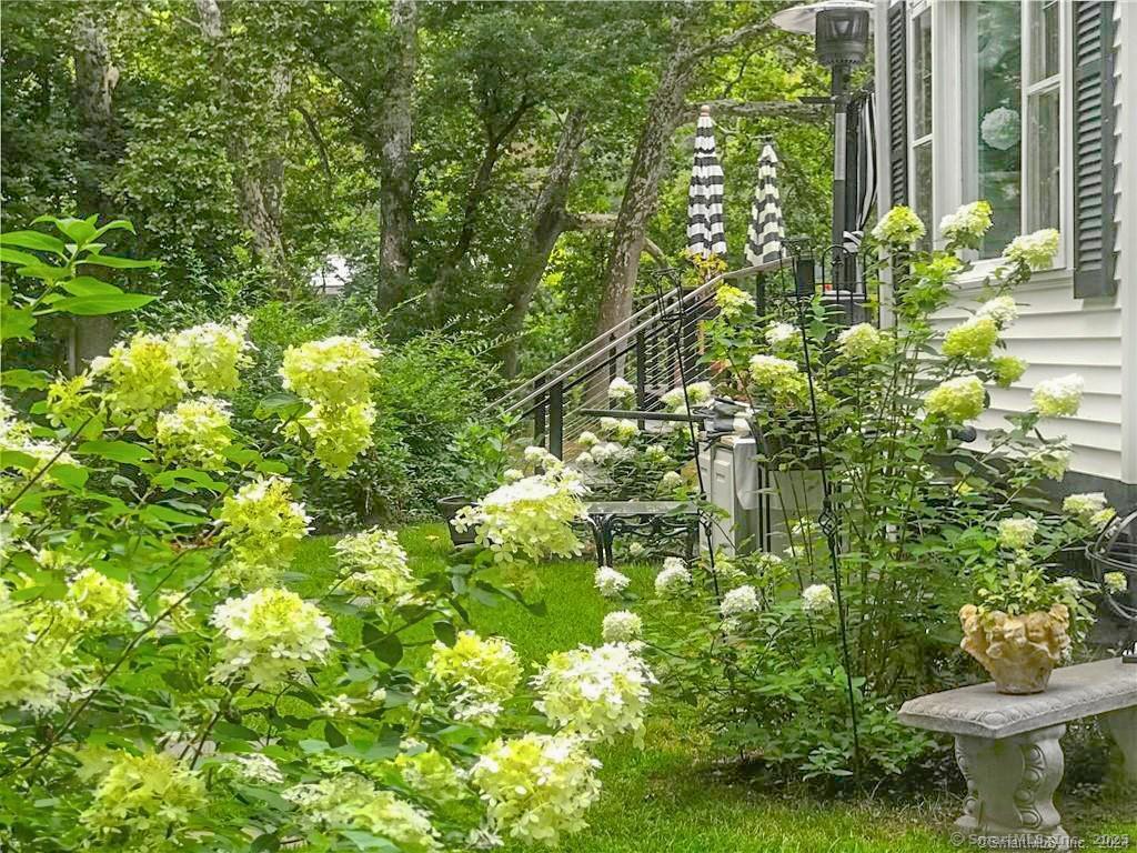 47 Johnson Road Kent, CT 06757 - Photo 31 of 40 a backyard of a house with a yard and fountain