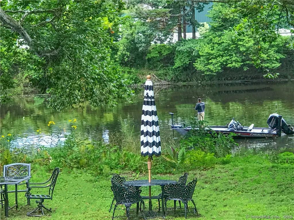 47 Johnson Road Kent, CT 06757 - Photo 35 of 40 a view of a lake with a table and chairs