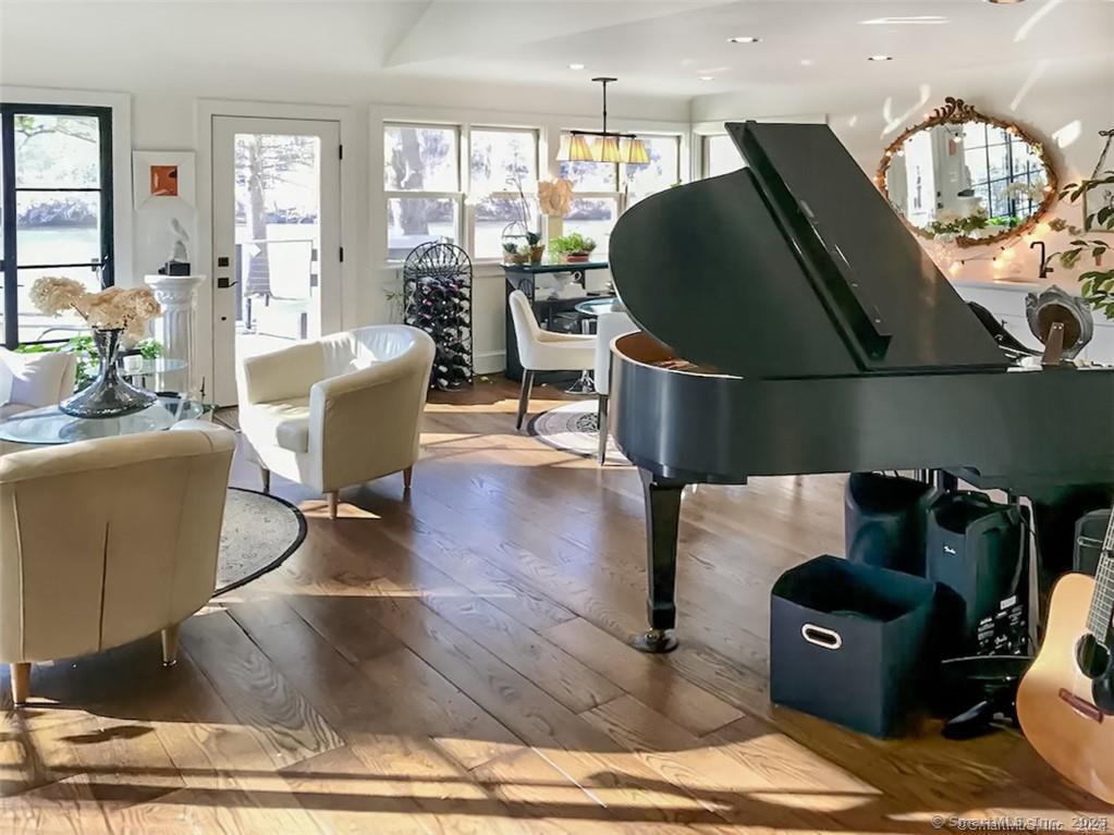 47 Johnson Road Kent, CT 06757 - Photo 5 of 40 a living room with furniture a chandelier and a dining table