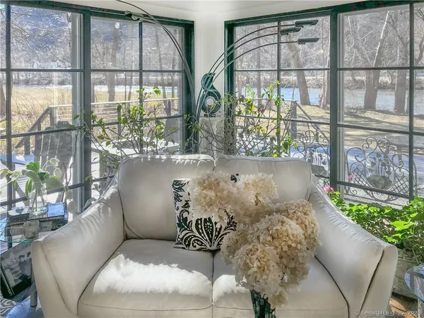 a living room with large windows
