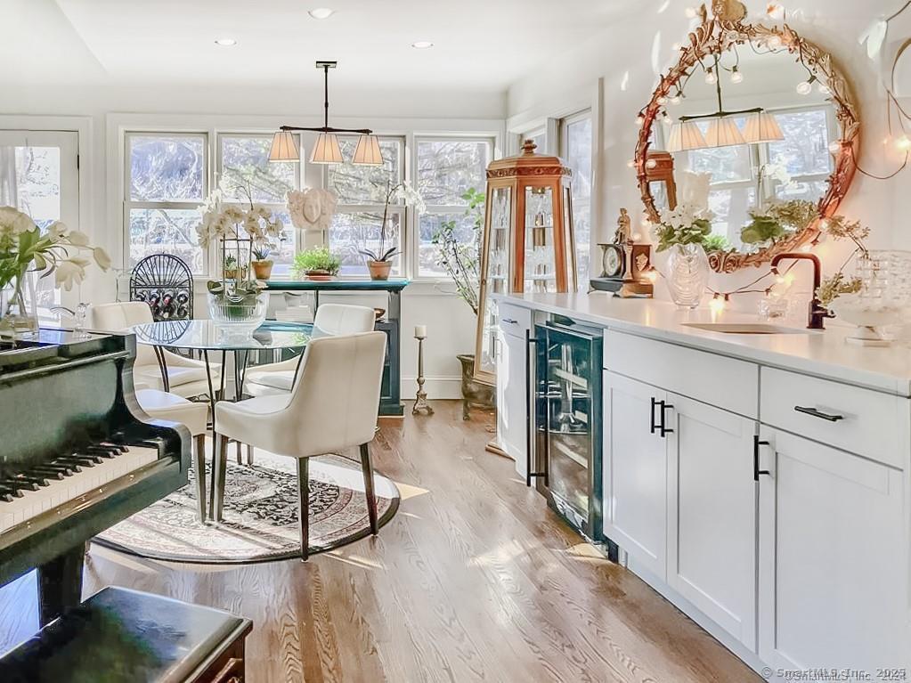 47 Johnson Road Kent, CT 06757 - Photo 9 of 40 a dining room with furniture a chandelier and wooden floor