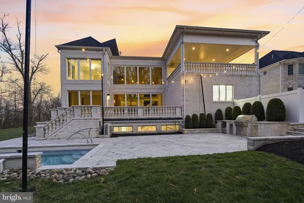 a large kitchen with a large counter top appliances and cabinets