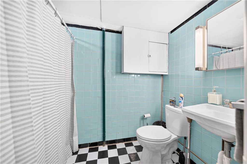 1642 Rostraver Road Belle Vernon, PA 15012 - Photo 22 of 32 a bathroom with a sink toilet and shower