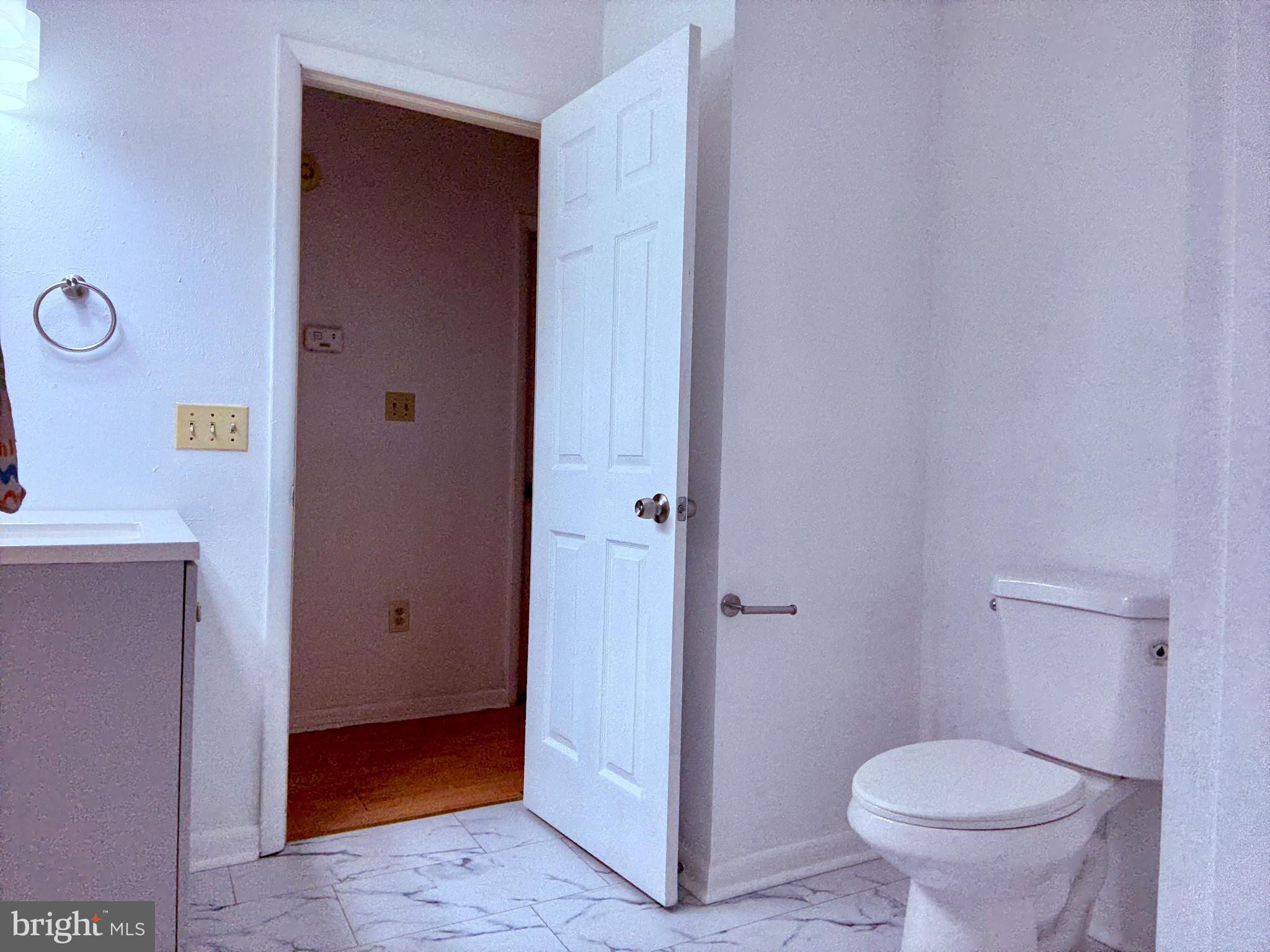 22 Windmill Lane Ocean View, DE 19970 - Photo 18 of 37 a bathroom with a granite countertop toilet and a sink