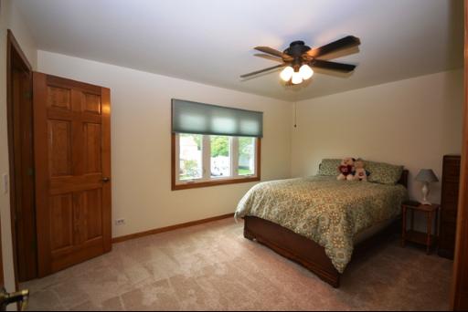 1860 Lisson Road Naperville, IL 60565 - Photo 13 of 16 a bedroom with a bed and window