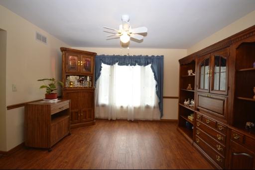 1860 Lisson Road Naperville, IL 60565 - Photo 8 of 16 a room with wooden floor and window