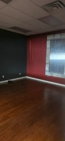 a view of room with wooden floor