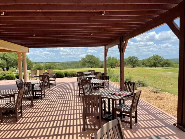a view of a patio with swimming pool
