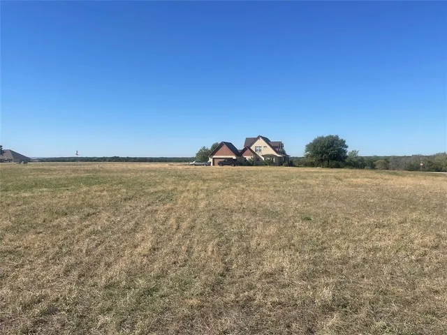 a view of a lake and a yard