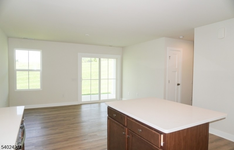 60 Coventry Road Hamburg, NJ 07419 - Photo 11 of 15 an empty room with wooden floor and windows