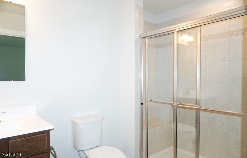 60 Coventry Road Hamburg, NJ 07419 - Photo 14 of 15 a bathroom with a shower and a toilet