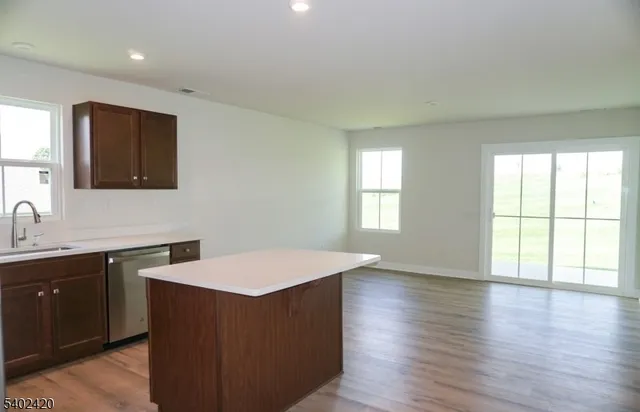 a room with wooden floor and window