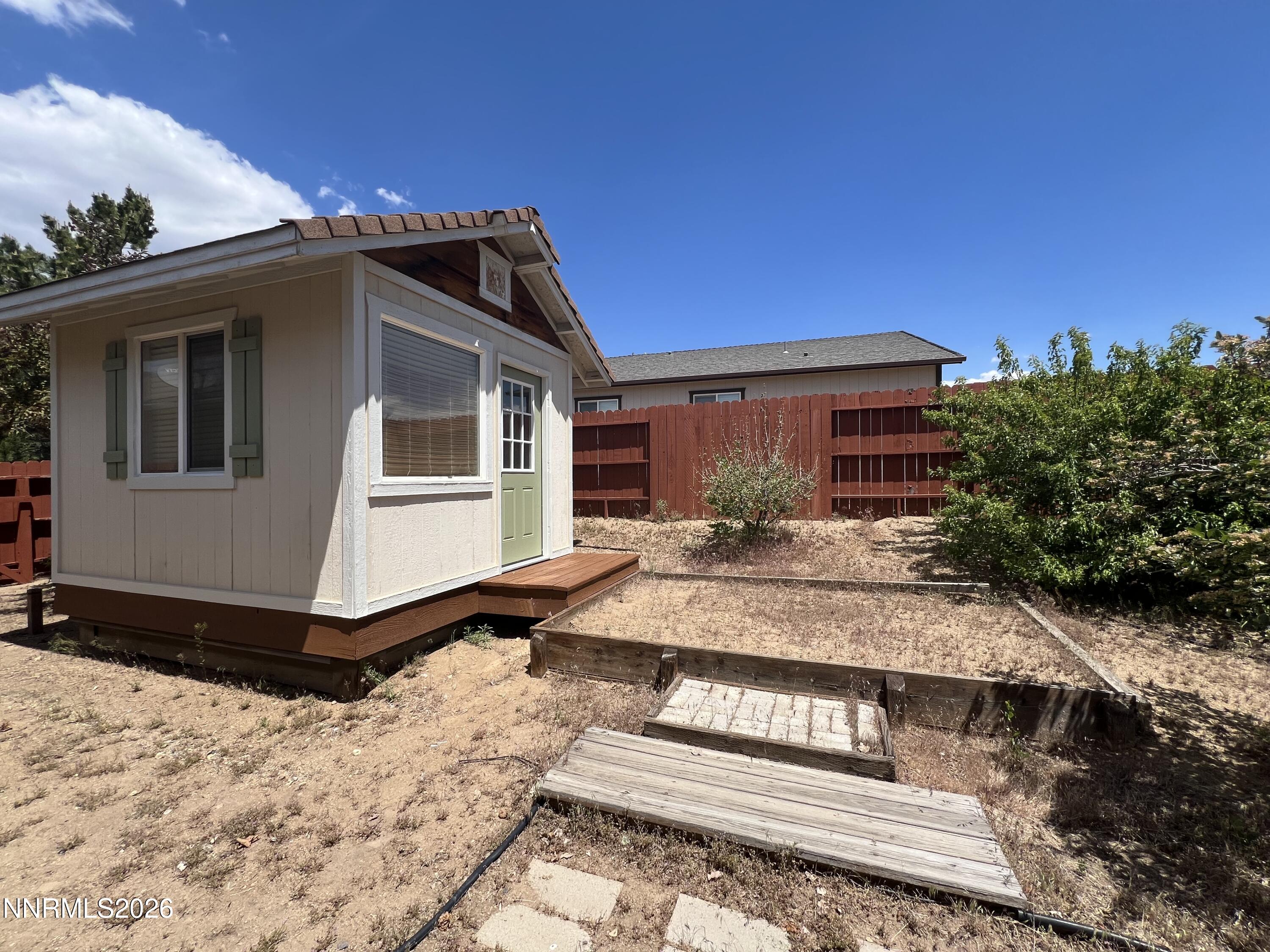 18406 Teddy Bear Court Reno, NV 89508 - Photo 38 of 44 a front view of a house with a yard
