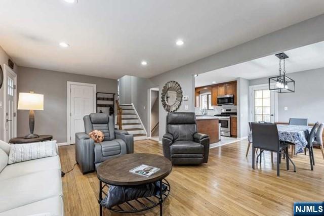 23 Asmus Road Closter, NJ 07624 - Photo 5 of 38 a living room with furniture a dining table and chairs