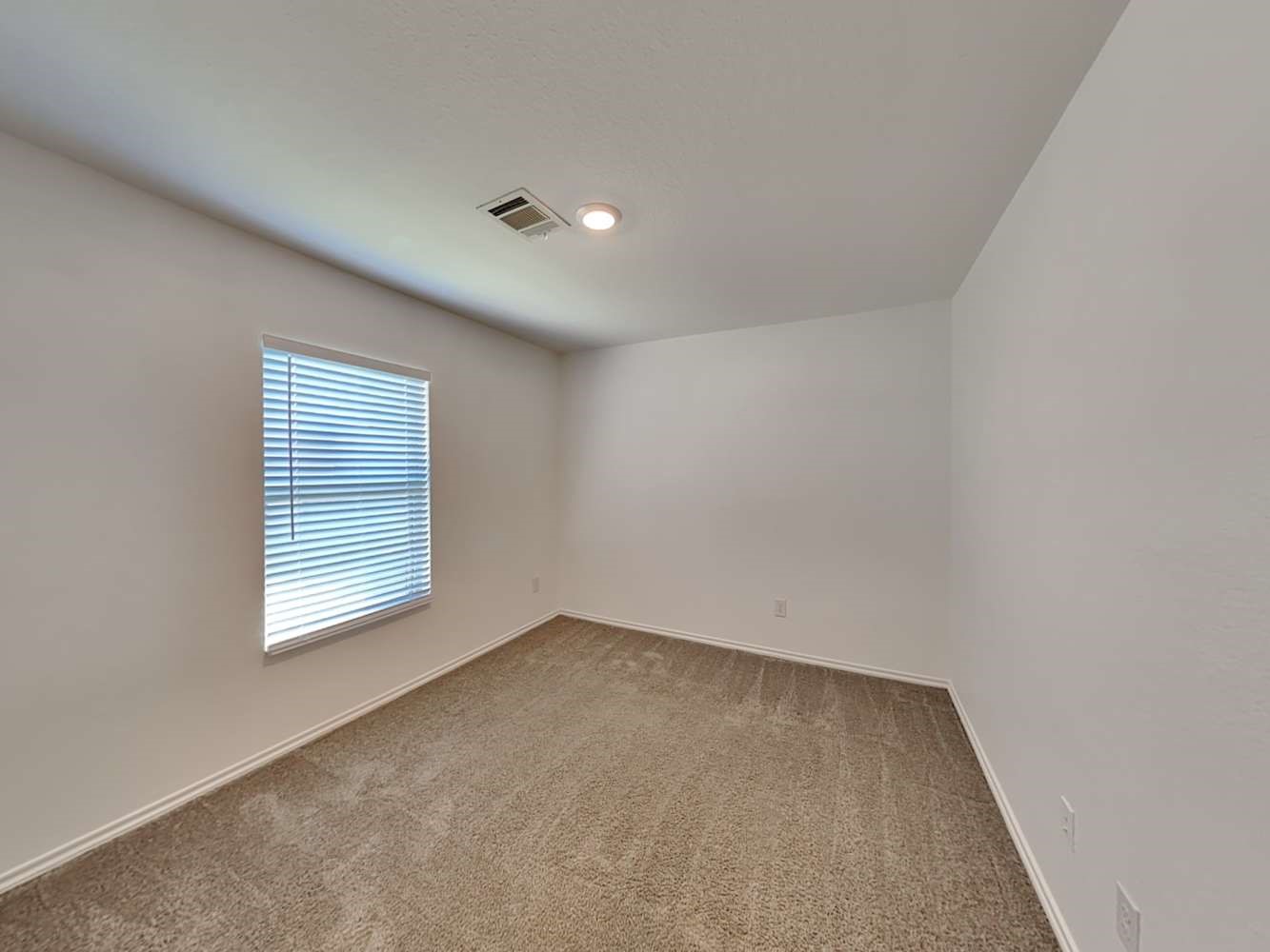 18823 Orvieto Court New Caney, TX 77357 - Photo 12 of 15 an empty room with windows