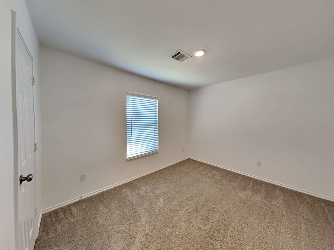 18823 Orvieto Court New Caney, TX 77357 - Photo 13 of 15 a view of an empty room with a window