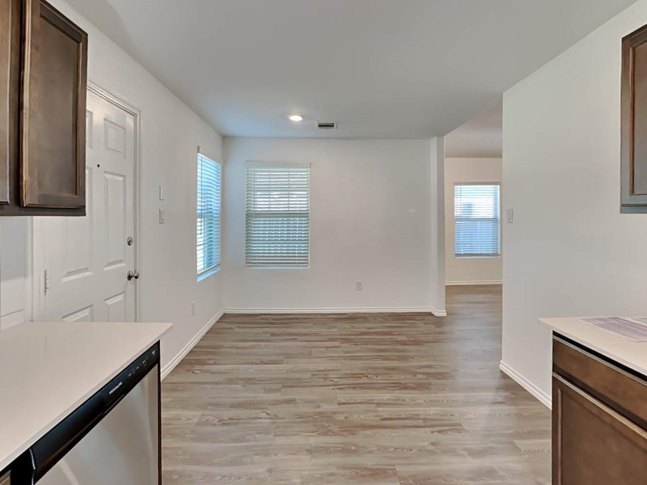 18823 Orvieto Court New Caney, TX 77357 - Photo 4 of 15 a view of an empty room with window and wooden floor