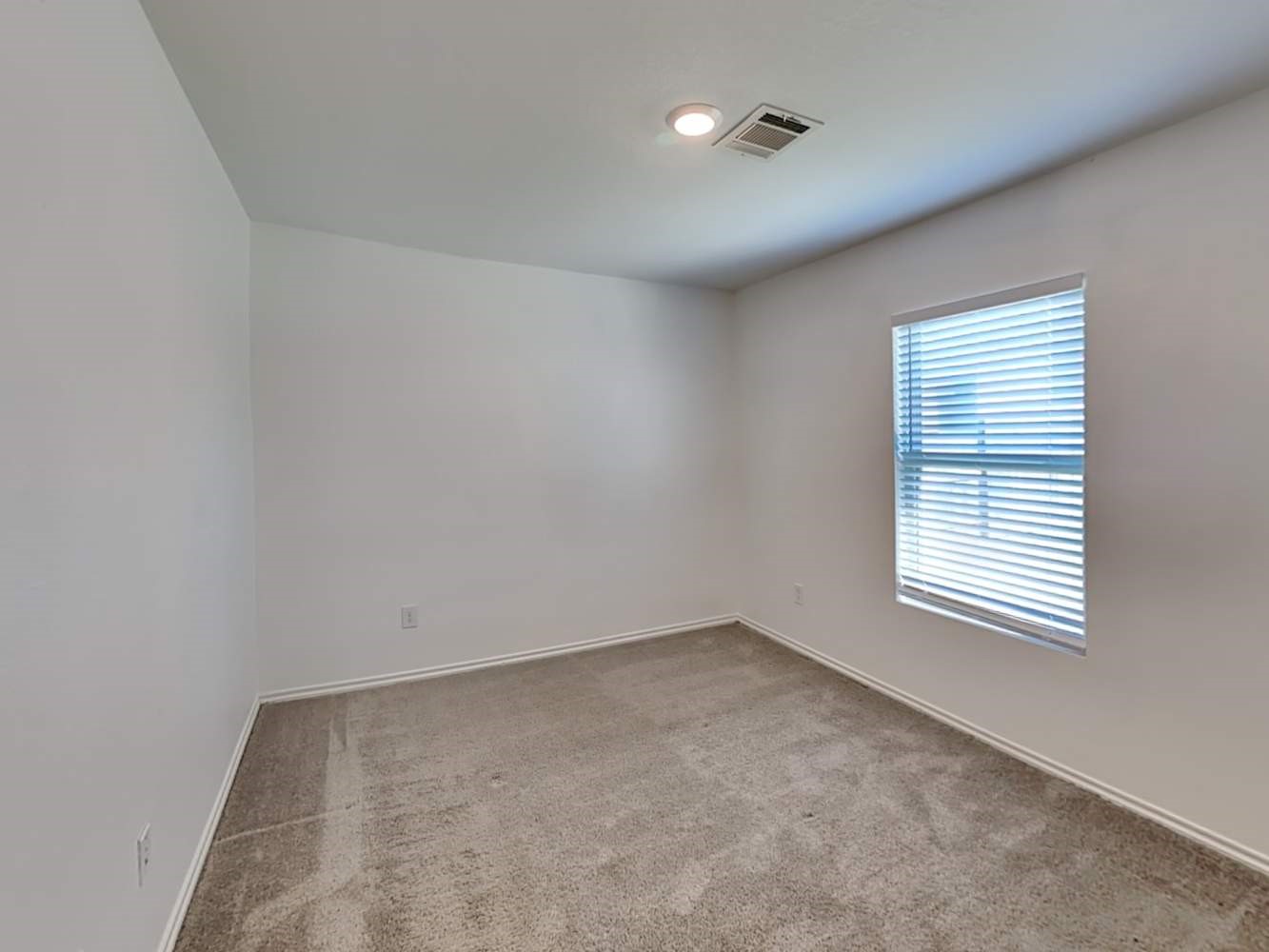 18823 Orvieto Court New Caney, TX 77357 - Photo 9 of 15 an empty room with a window