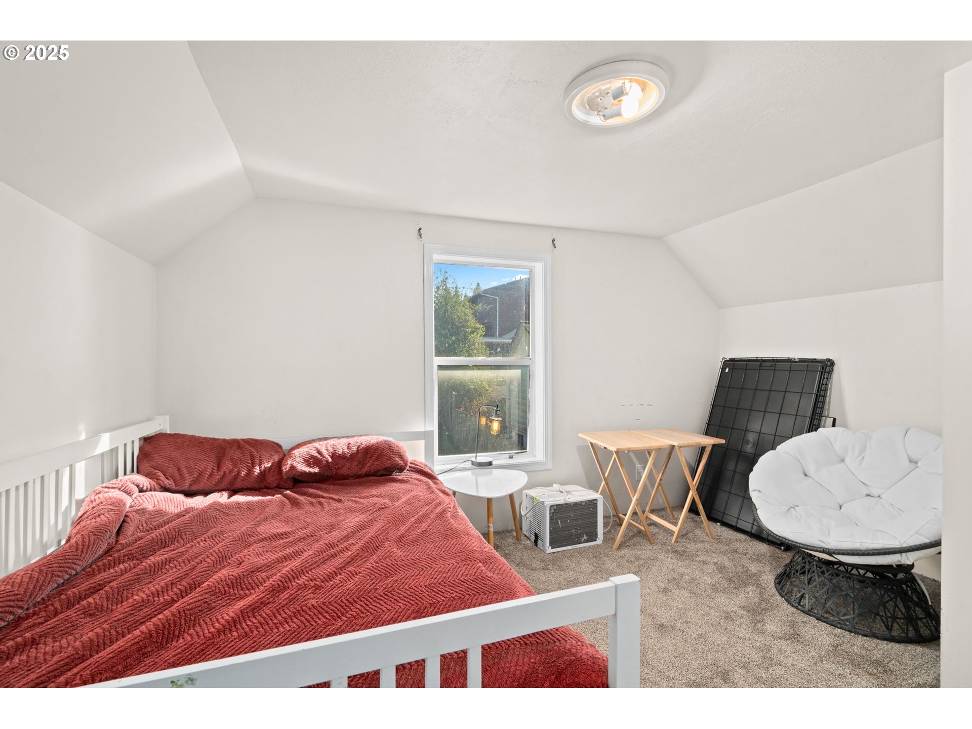 410 East D Street Rainier, OR 97048 - Photo 11 of 18 a bedroom with a bed and a table in it
