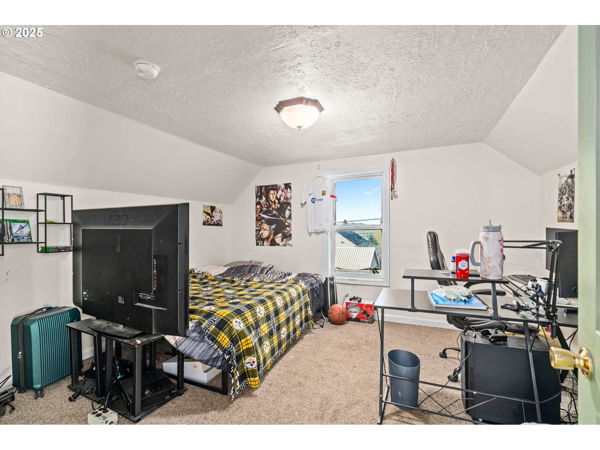410 East D Street Rainier, OR 97048 - Photo 12 of 18 a living room with furniture and a flat screen tv