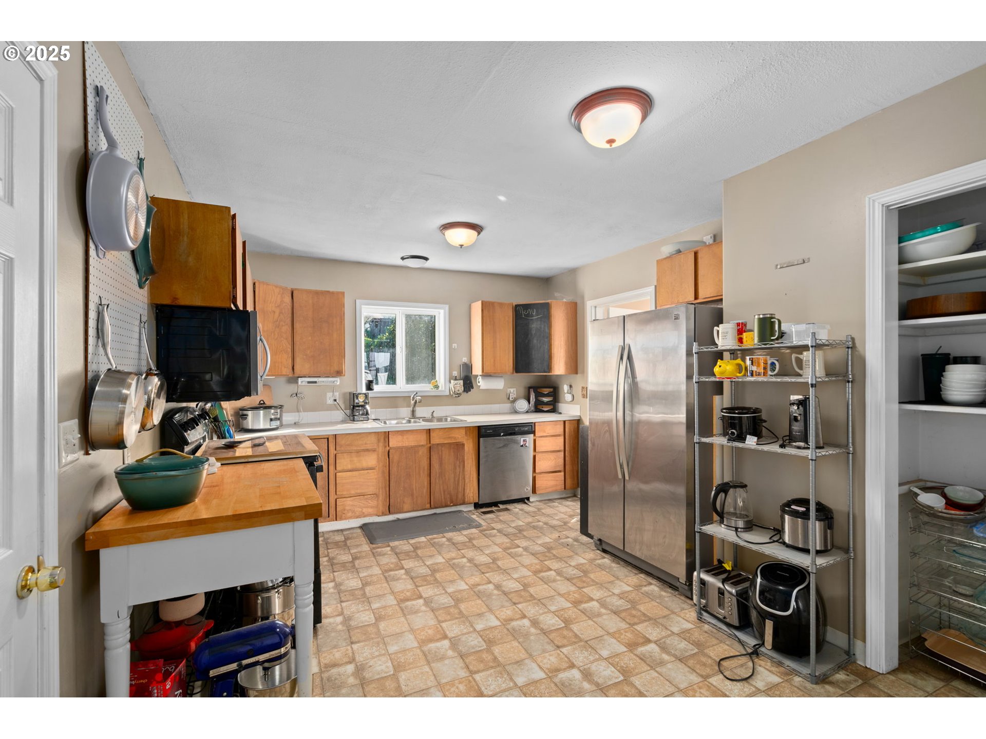 410 East D Street Rainier, OR 97048 - Photo 14 of 18 a kitchen with a refrigerator and a stove