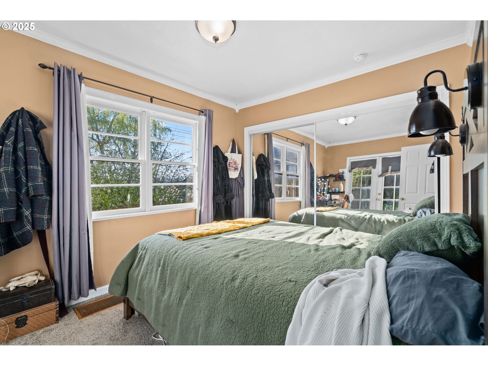 410 East D Street Rainier, OR 97048 - Photo 16 of 18 a bedroom with a bed and a large window