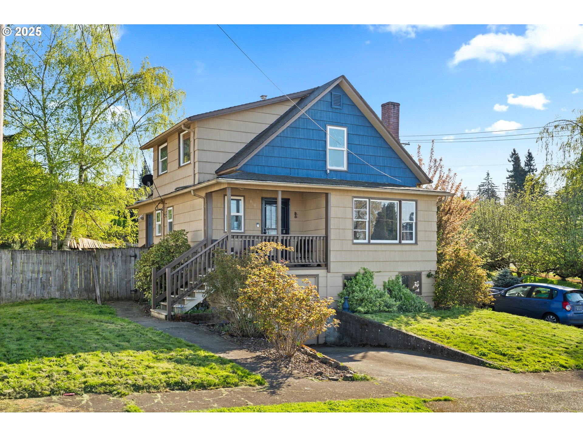 410 East D Street Rainier, OR 97048 - Photo 2 of 18 a front view of a house with garden