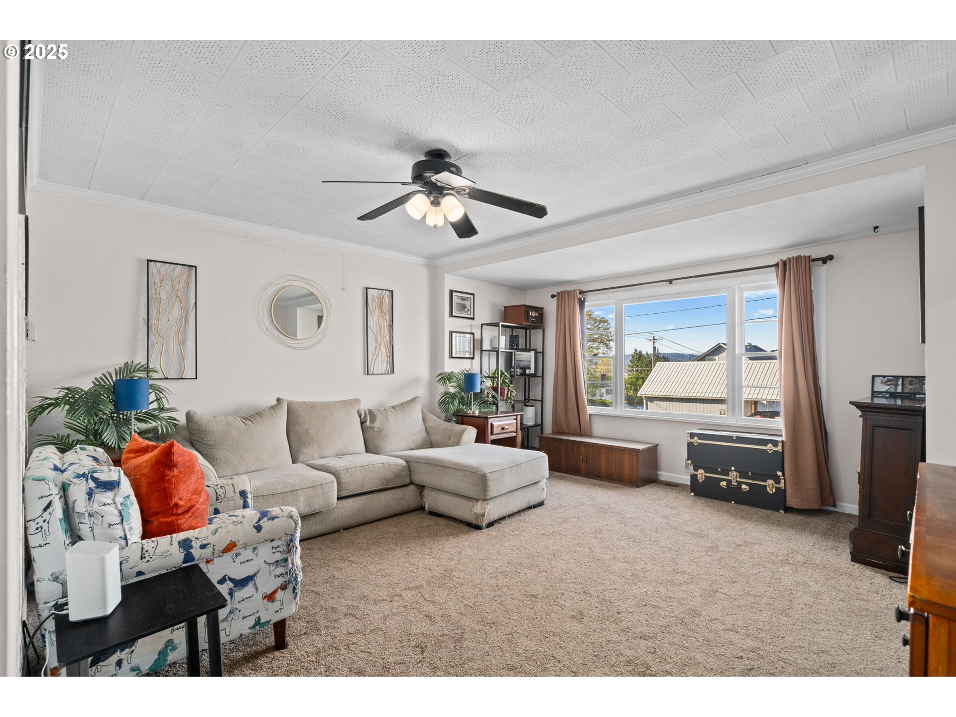 410 East D Street Rainier, OR 97048 - Photo 5 of 18 a living room with furniture and a flat screen tv