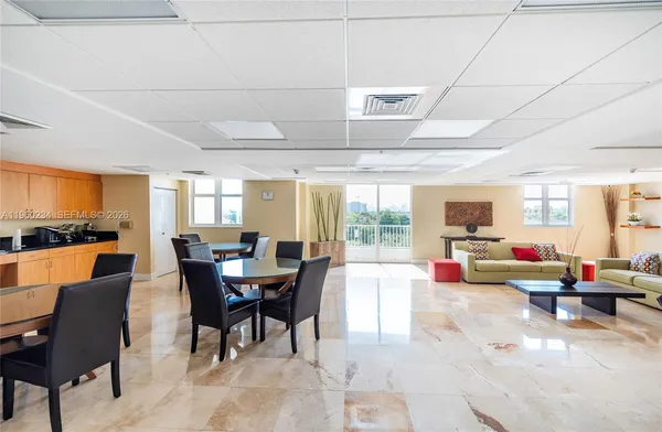 a view of swimming pool with outdoor seating