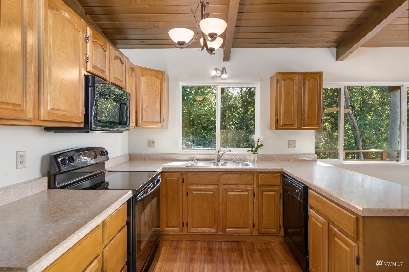 30807 26th Avenue Southwest Federal Way, WA 98023 - Photo 18 of 40 a kitchen with a sink stove and cabinets