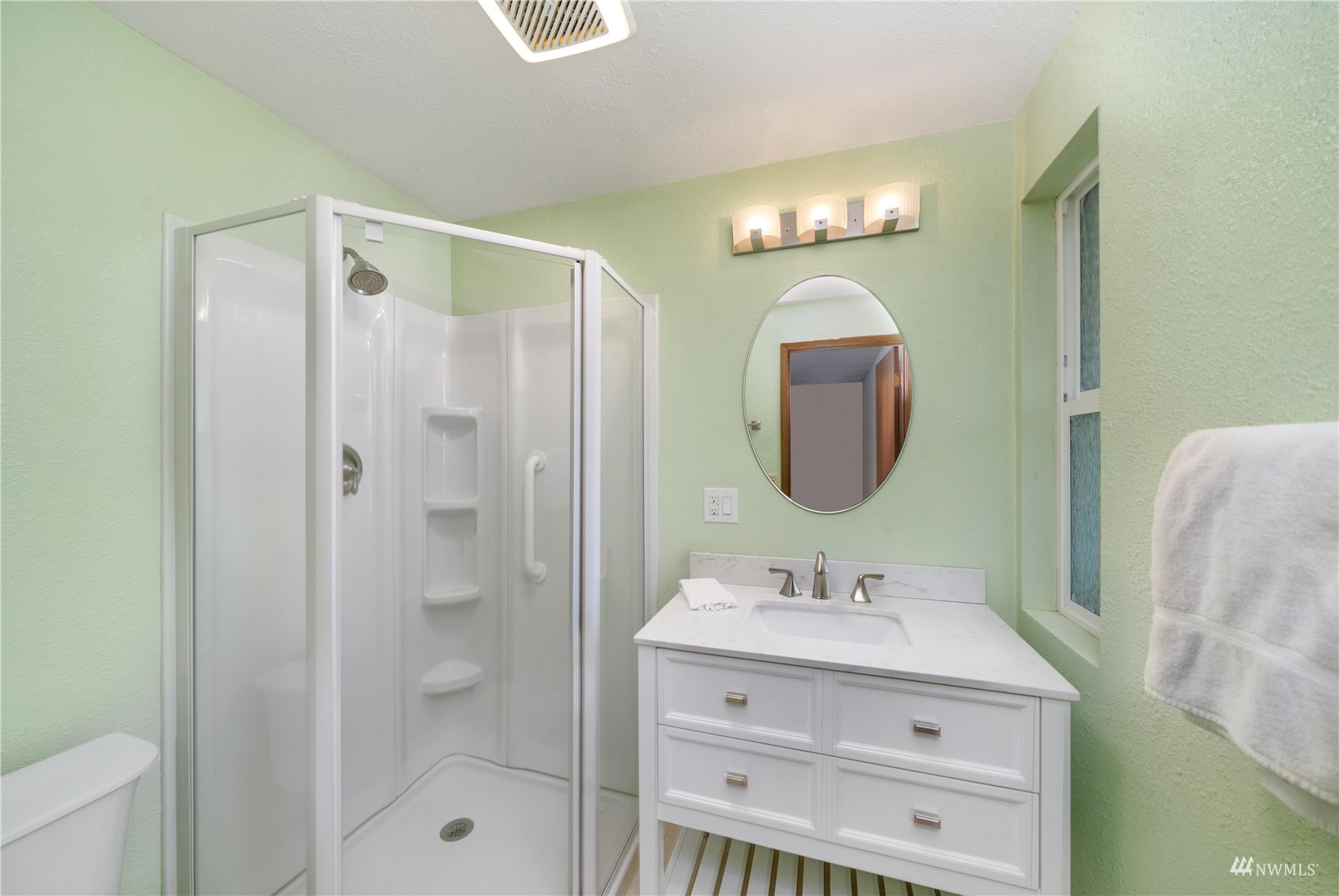 30807 26th Avenue Southwest Federal Way, WA 98023 - Photo 23 of 40 a bathroom with a sink mirror and a shower