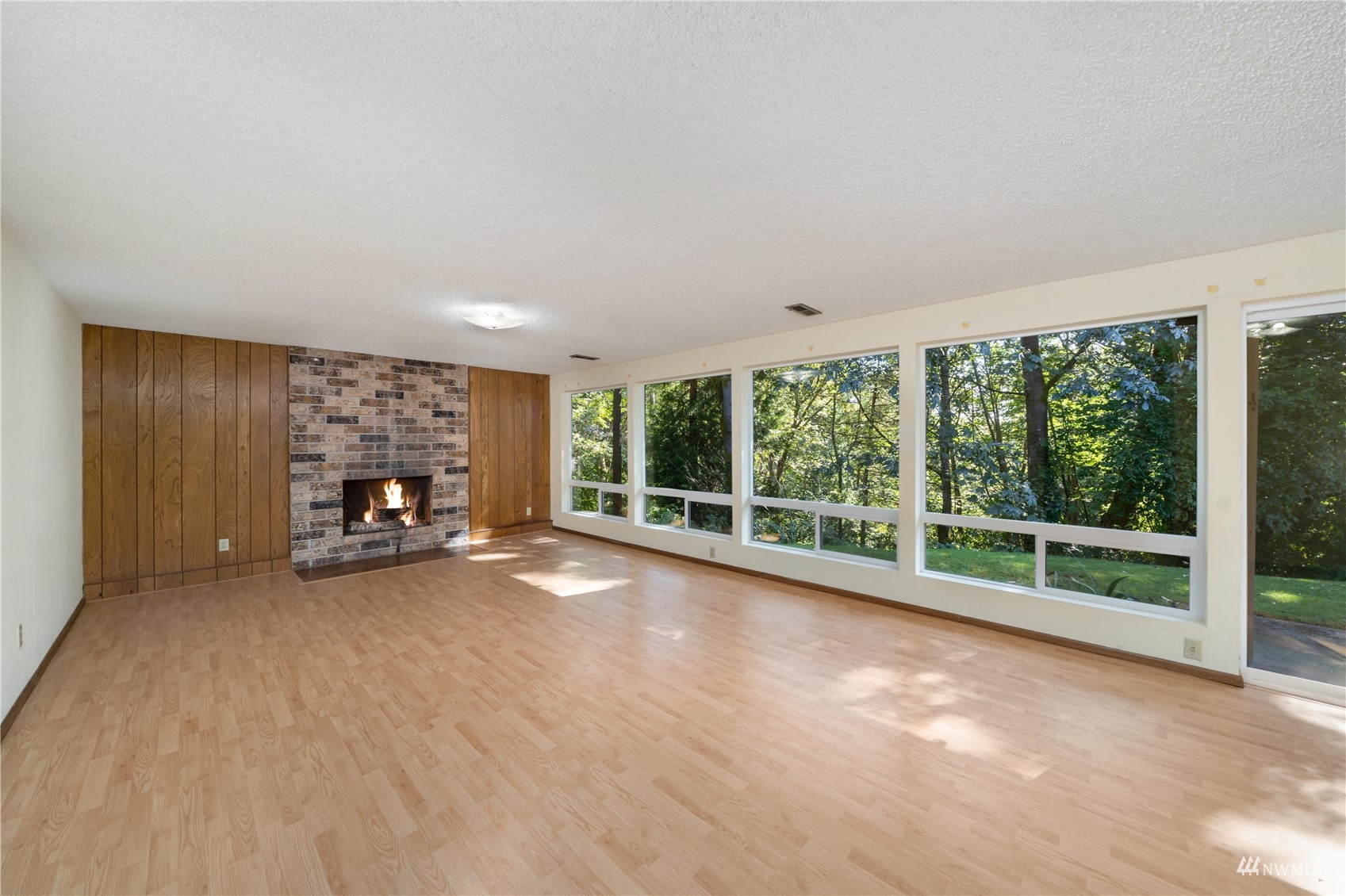 30807 26th Avenue Southwest Federal Way, WA 98023 - Photo 28 of 40 a view of an empty room with a fireplace and a large window