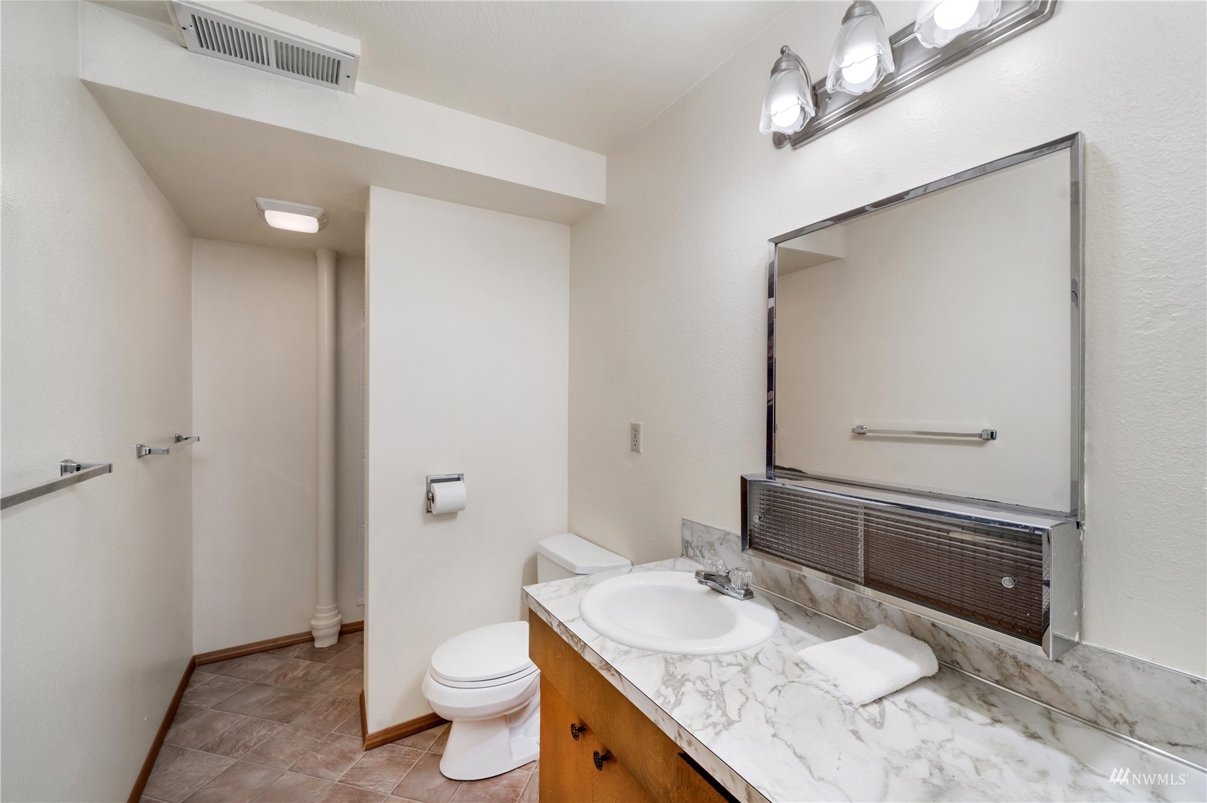 30807 26th Avenue Southwest Federal Way, WA 98023 - Photo 30 of 40 a bathroom with a granite countertop sink a toilet a mirror and shower