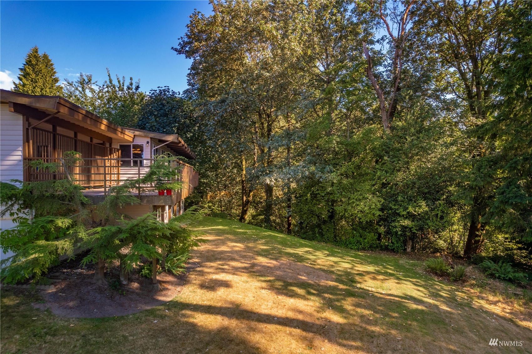 30807 26th Avenue Southwest Federal Way, WA 98023 - Photo 5 of 40 a yellow house with trees in front of it