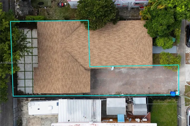 an aerial view of residential house with outdoor space