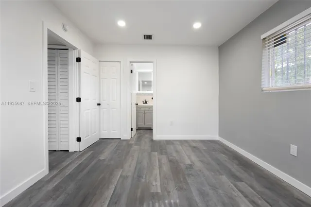a bathroom with a sink toilet a mirror and shower