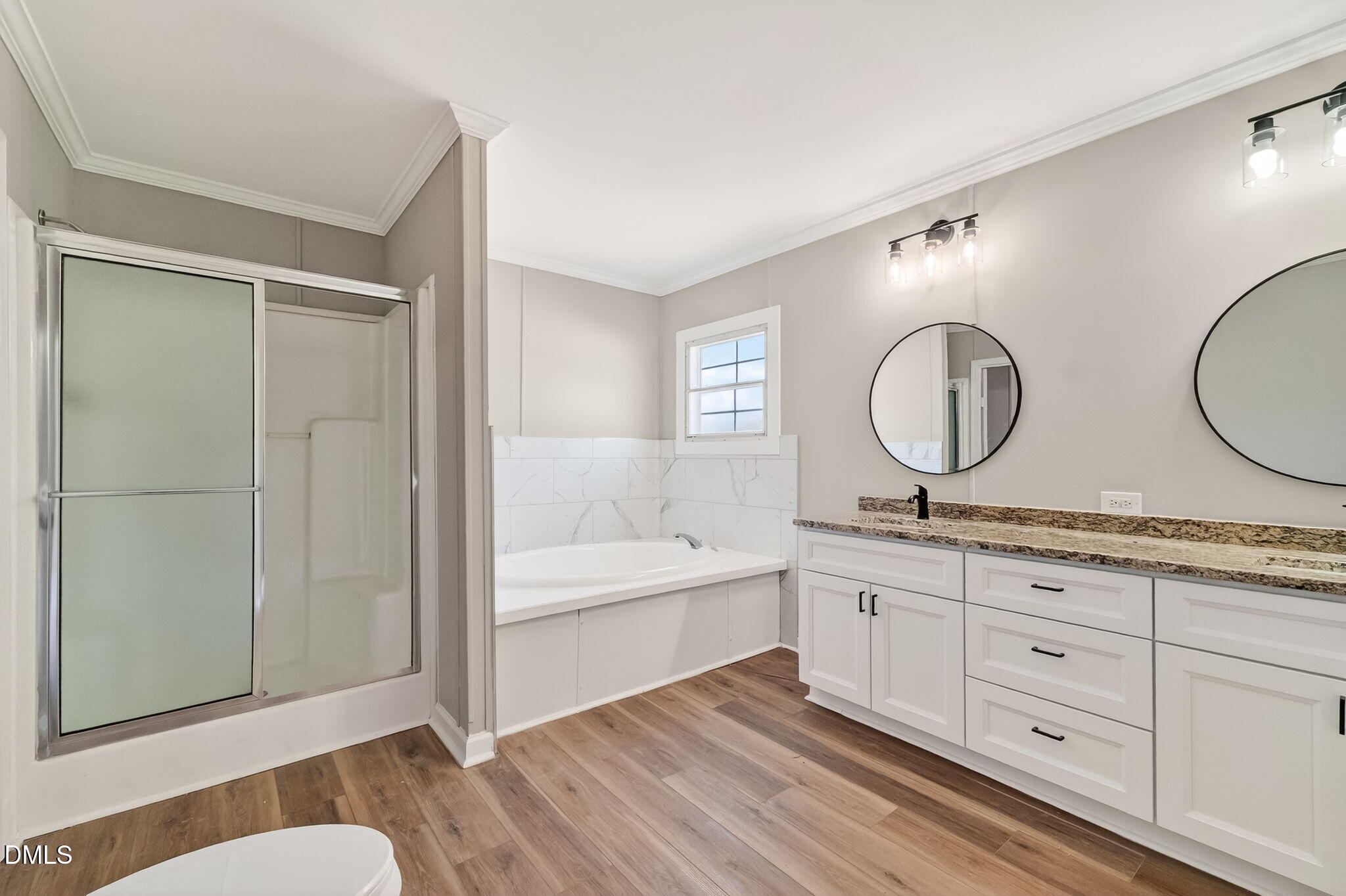 10015 Smith Road Middlesex, NC 27557 - Photo 27 of 48 a spacious bathroom with a granite countertop sink mirror and bathtub