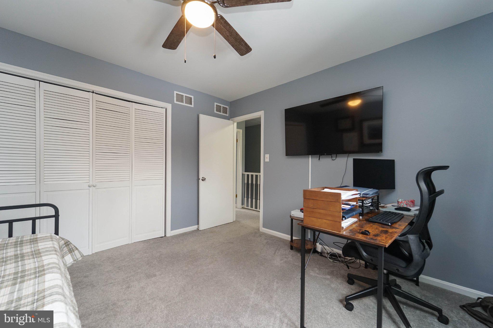 211 Queen Anne Road Stevensville, MD 21666 - Photo 25 of 33 Cozy bedroom with modern amenities.