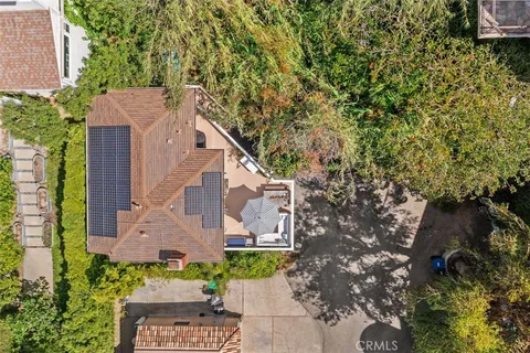 front view of a house with a tree