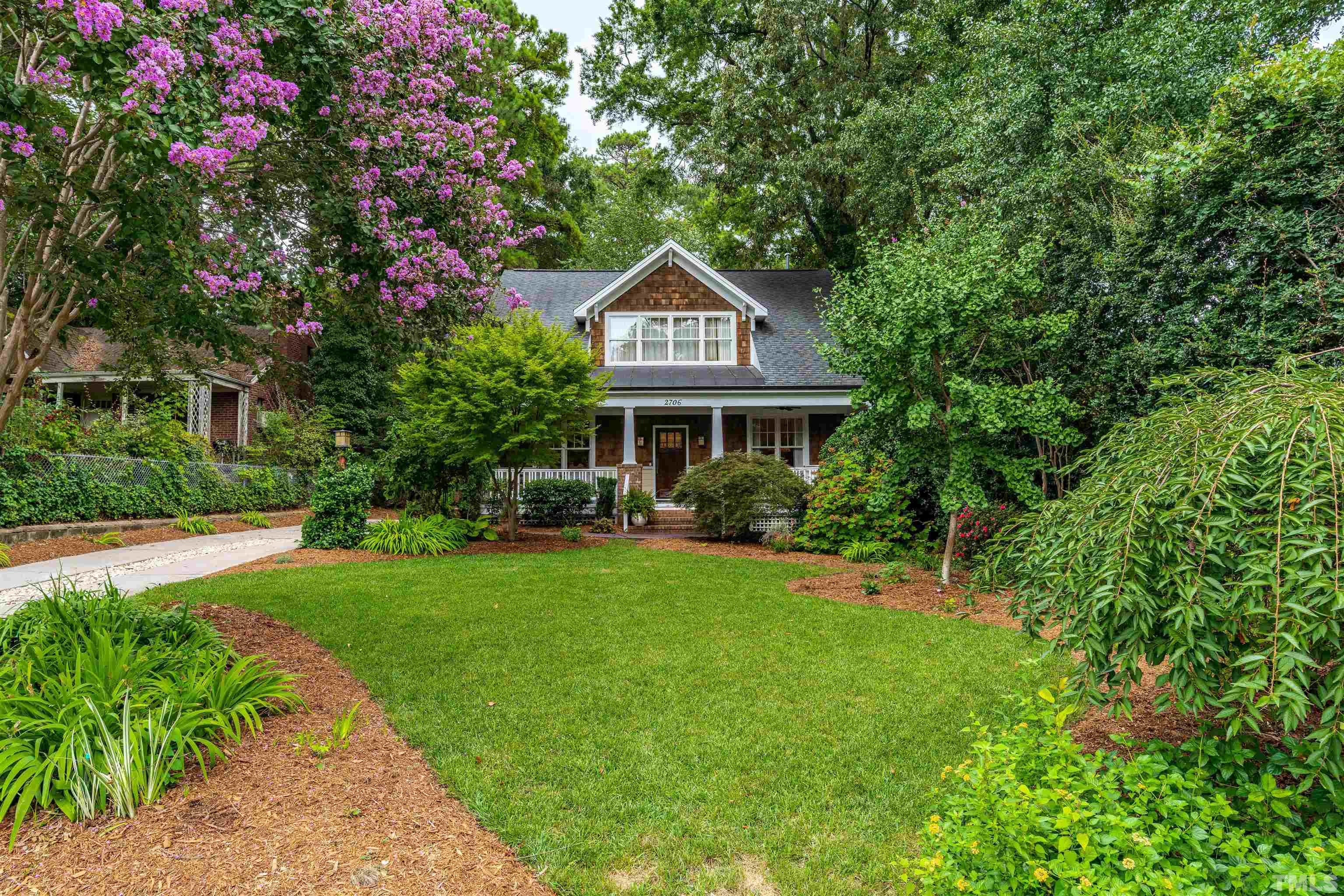 2706 Barmettler Street Raleigh, NC 27607 - Photo 2 of 43 a front view of a house with yard and green space