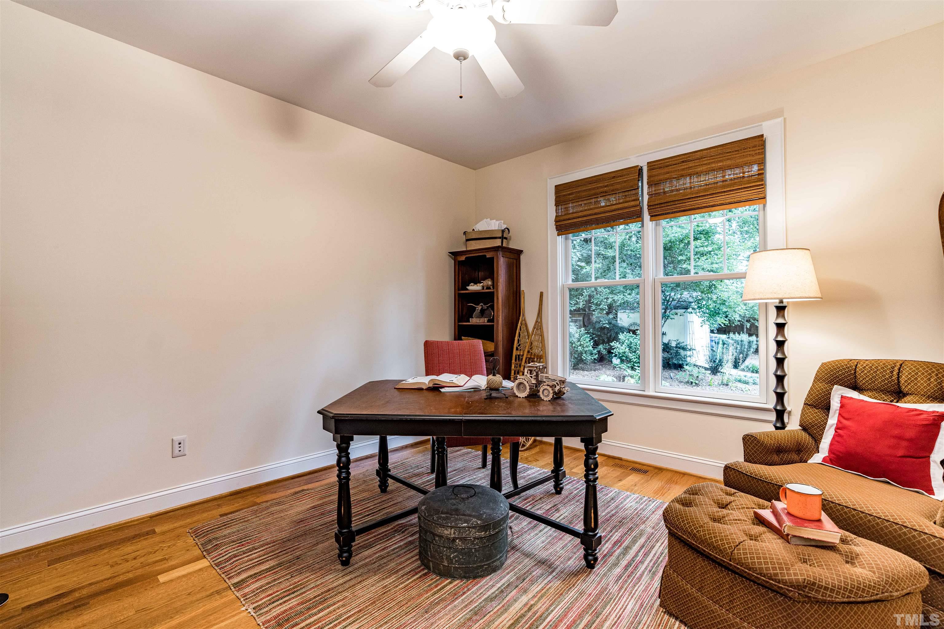 2706 Barmettler Street Raleigh, NC 27607 - Photo 23 of 43 a living room with furniture and a large window